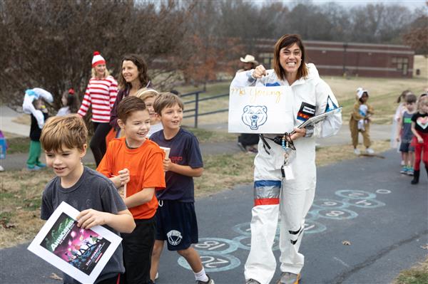 students walking with books